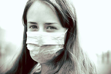 the girl in the mask is on a red square, strong managedの写真素材