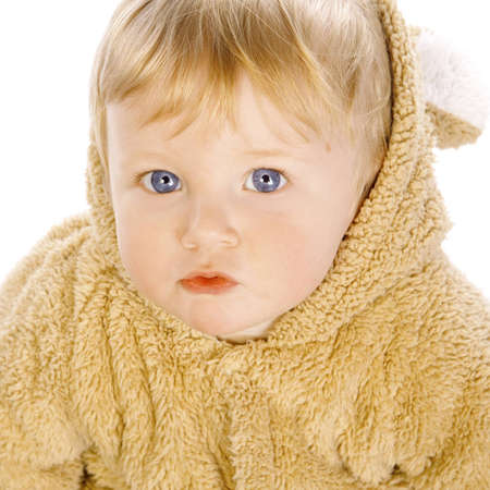 a little boy in a yellow fur suit on a white background in studioの写真素材