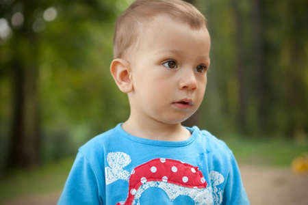 a little boy in blue T-shirt