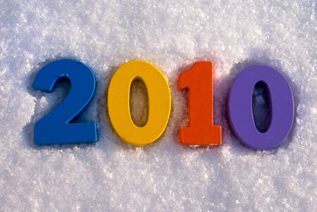 Coloured numbers 2010 on the fresh white snowの写真素材