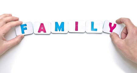 male and female hands creating word family with magnetic letters                               の写真素材