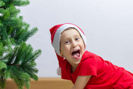 Boy with Santa Claus Hat. Christmas timeの写真素材