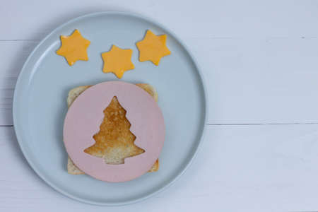 Christmas food. Toast and sausage in the shape of a Christmas tree