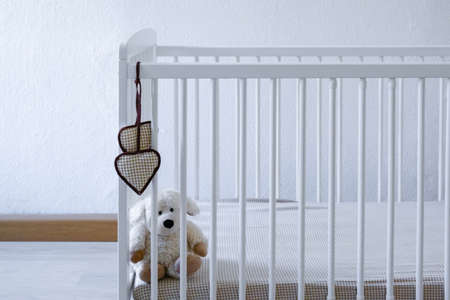 white baby bed. Waiting for a babyの写真素材