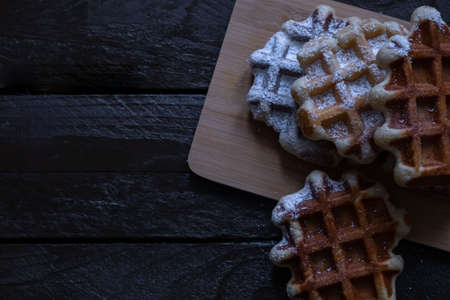 Belgian waffles on a wooden tableの写真素材