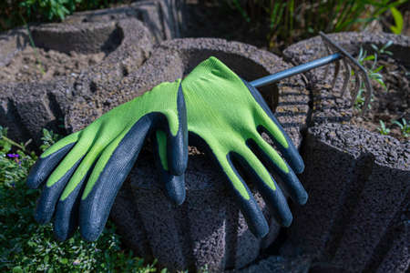 Garden gloves in the beds. Gardening conceptの写真素材
