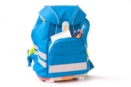 Classic colored school backpack with supplies. Preparation for school. Back to schoolの写真素材