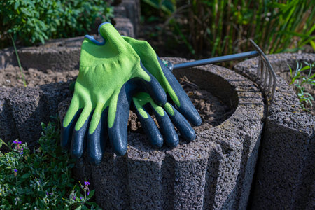 Garden gloves in the beds. Gardening concept