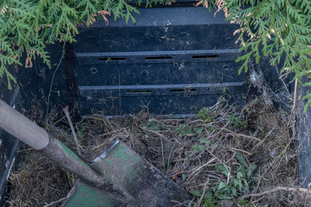 Compost bin in the garden. Garden shovel. Organic garden conceptの写真素材