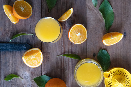 Orange fruit with green leaves on the wood. Home gardening. . Orange color. Fresh orange juice.の写真素材