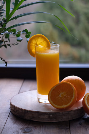Freshly squeezed orange juice in a glassの写真素材