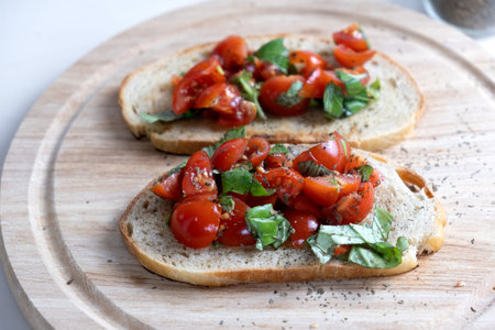 Sandwiches with baked cherry tomatoes. Bruschetta with tomatoesの写真素材
