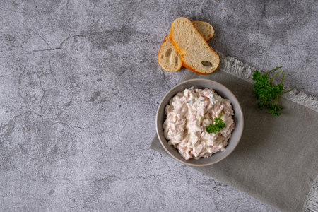 Meat salad with mayonnaise and cucumbersin a bowl. Udder saladの写真素材