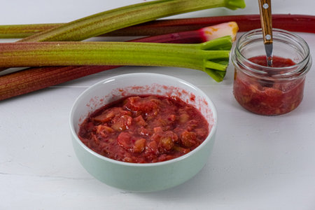 homemade rhubarb jam on white backgroundの写真素材