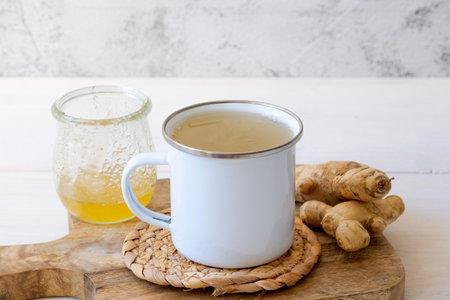 Ginger tea in a mug on a white backgroundの写真素材