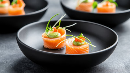 Fine dining presentation of smoked salmon canap in matte black bowls with minimal garnishesの素材