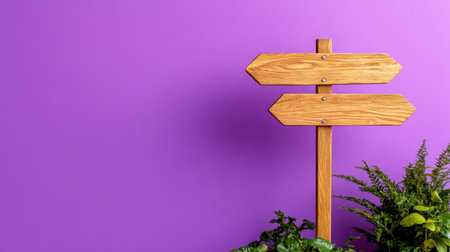 Wooden sign with carved arrows mounted on a post, against a pastel purple settingの素材
