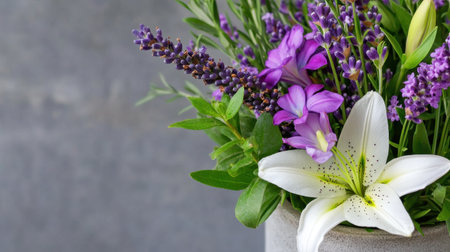 Gentle arrangement of lavender and lily surrounded by subtle gray framingの素材
