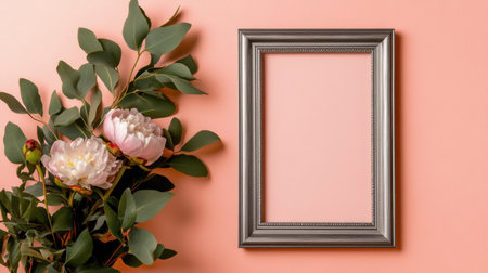Silver vintage frame with blush peonies and eucalyptus on pastel peachの素材