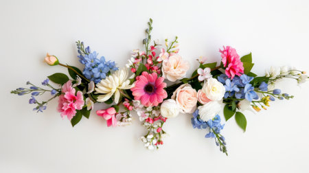 This stunning floral arrangement features a variety of pink, blue, and white flowers elegantly displayed on a light background, perfect for enhancing decorative themes.の素材