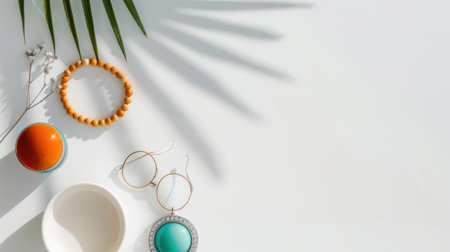 This stylish flat lay composition showcases an array of accessories harmoniously arranged on a bright surface. Natural elements like palm leaves enhance the aesthetic, creating a modern and tranquil scene. Ideal for lifestyle and design projects.の素材