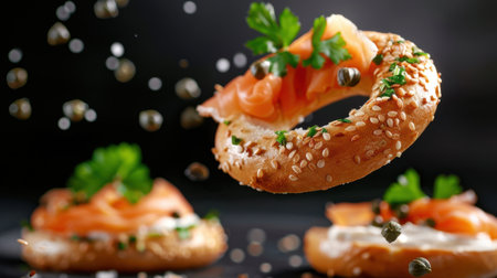 A beautifully styled bagel topped with smoked salmon, cream cheese, and capers, garnished with fresh herbs, floating in mid-air against a dark backdrop.の素材