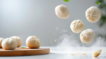 A dynamic image showcasing fresh dumplings in mid-air, surrounded by flour dust and green herbs, capturing the beauty of culinary preparation in a bright kitchen setting.の素材