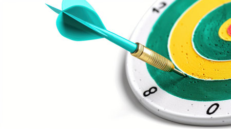 A close-up view of a dart hitting a colorful bullseye target, capturing the essence of precision, focus, and competition in a game setting.の素材