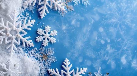 A serene winter scene featuring delicate snowflakes on a soft blue background, accented with white snow to create a magical and festive atmosphere.の素材