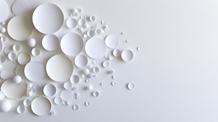 A collection of white circular shapes arranged on a soft light background, creating a modern and abstract aesthetic perfect for minimalistic designs and creative projects.の素材