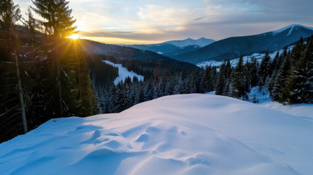 This breathtaking winter scene captures a snow-covered landscape at sunset, showcasing a serene forest and distant mountains, inviting tranquility and peace.の素材