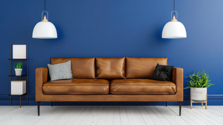 A stylish living room scene featuring a brown leather sofa centered on a vibrant blue wall. Elegant pendant lights illuminate the space, complemented by indoor plants and modern decor elements. Perfect for creating a cozy atmosphere.の素材
