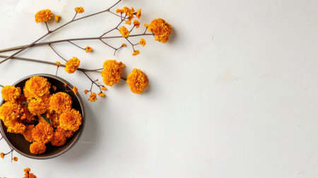 A stunning arrangement of vibrant yellow flowers placed in a rustic bowl against a soft white surface, perfect for home decor or creative projects.の素材