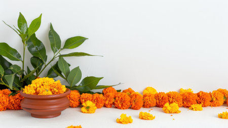 A beautiful arrangement of vibrant orange marigold flowers alongside green leaves in an earthen pot, perfect for festive decorations and celebrations.の素材