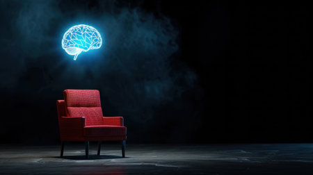 A striking red chair sits in a dimly lit space, illuminated by a neon brain sign above, symbolizing creativity and innovative thinking. This image evokes introspection.の素材