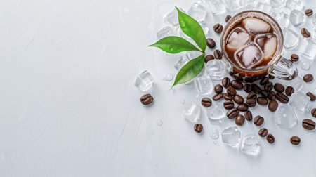 A close-up view of a refreshing iced coffee in a glass mug surrounded by ice cubes and coffee beans, perfect for summer refreshment ideas.の素材