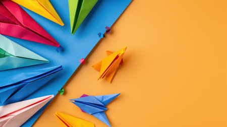 A captivating arrangement of colorful paper airplanes in various shapes rests on a vibrant background. Ideal for creative projects or educational materials, this image showcases the joy of crafting and imagination.の素材