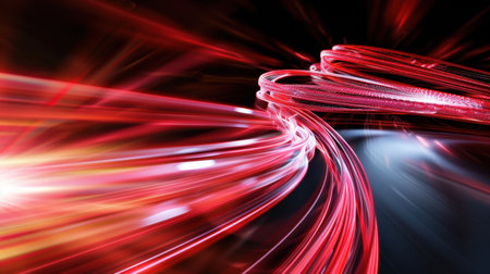 An abstract representation of dynamic red light waves flowing across a dark background, conveying energy, motion, and creativity in a stunning visual display.の素材