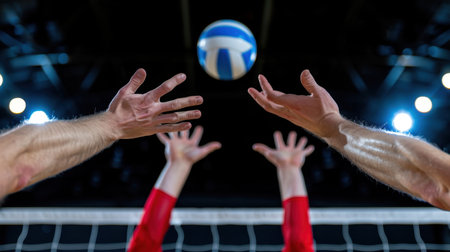 Close-up view of players' hands reaching for a volleyball during an intense game inside a vibrant stadium, showcasing energy and teamwork in action.の素材