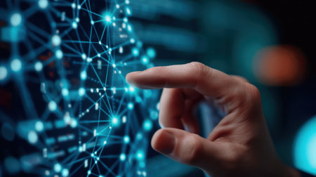 A close-up view of a hand interacting with a digital network, showcasing advanced technology and data connections in a futuristic setting.の素材