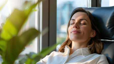 A serene woman sits comfortably in a modern chair, eyes closed and enjoying tranquility, surrounded by green plants and city views, promoting relaxation.の素材