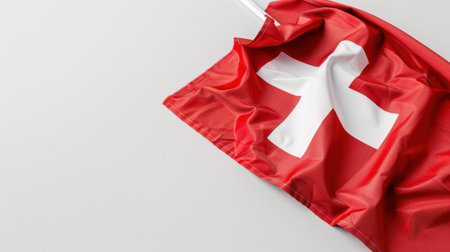Vibrant image showcasing the Switzerland flag featuring a striking red background and a prominent white cross, emphasizing national identity and pride.の素材