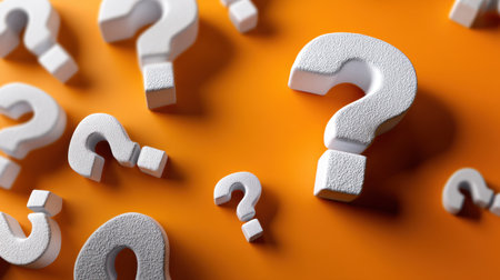 A vibrant composition featuring white question mark shapes against a bold orange backdrop, evoking themes of curiosity and exploration in creative projects.の素材