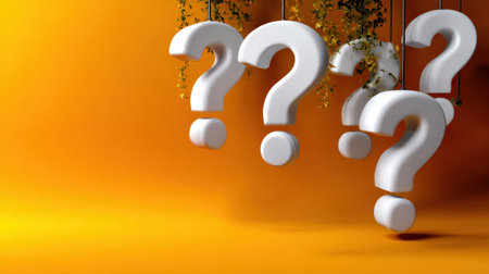 An artistic representation of multiple question marks hanging gracefully against a vibrant orange backdrop, symbolizing curiosity and inquiry.の素材