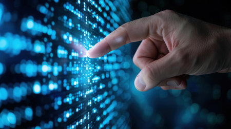 A hand reaching out to interact with a flowing digital data stream filled with glowing blue lights, illustrating modern technology and innovation themes.の素材