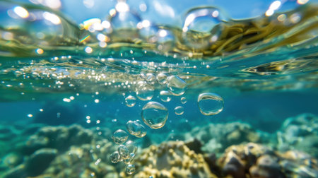 This mesmerizing underwater scene captures bright bubbles rising gracefully above a vibrant coral reef, illuminated by radiant sunlight filtering through the water.の素材
