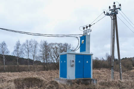 low-voltage transformer in the country, a new power line in the villageの写真素材