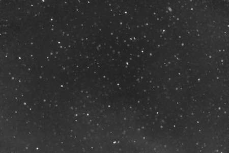 white snow on a black background, background imageの写真素材