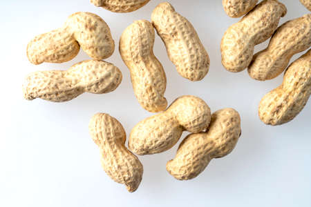 peeled peanuts and inshell peanutsの写真素材