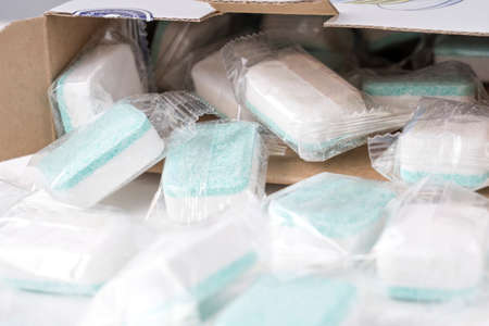dishwasher tablets in an open box, selective focusの写真素材